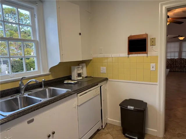 a kitchen with a sink and a stove