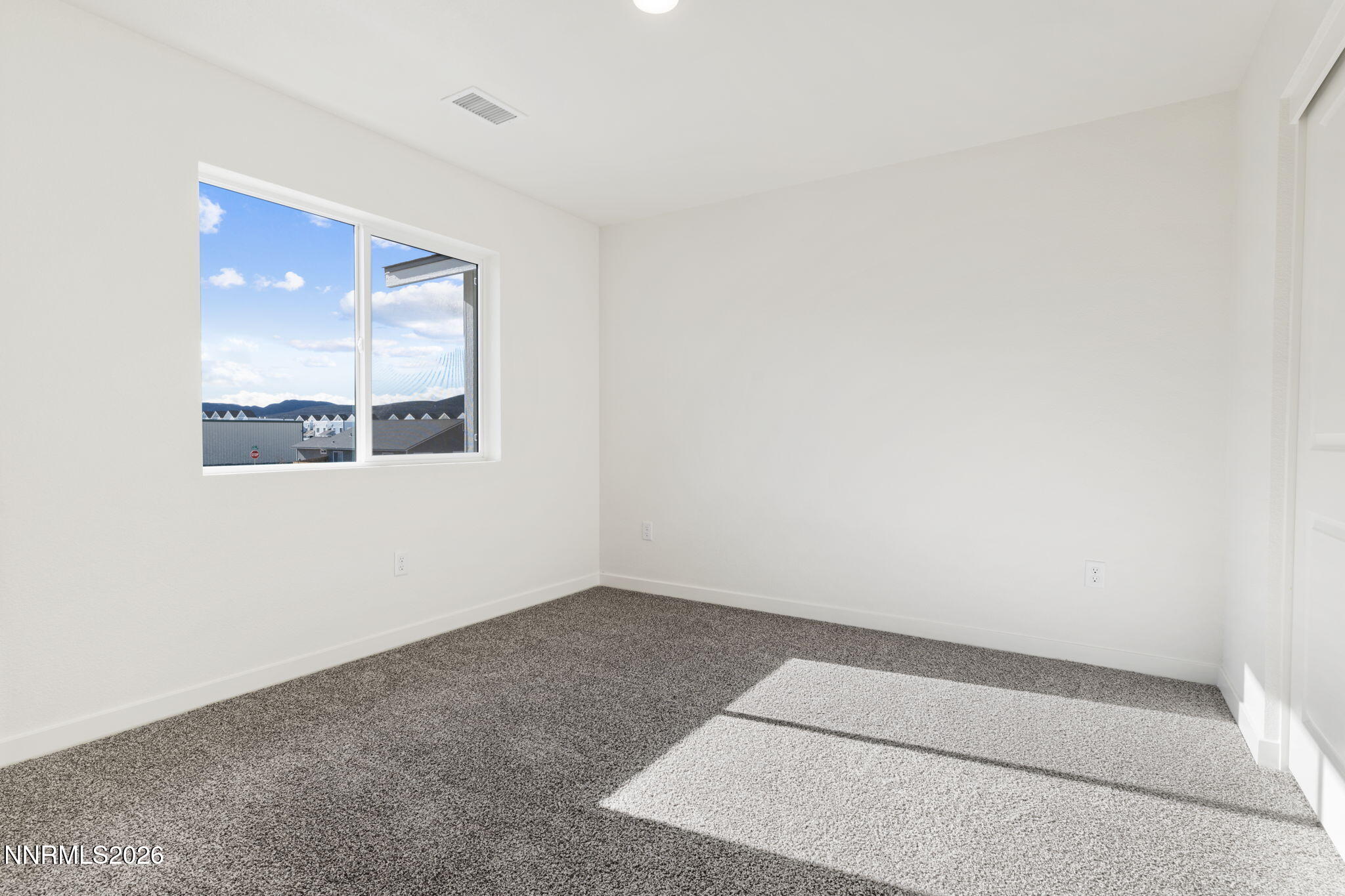357 Halite Drive Dayton, NV 89403 - Photo 13 of 20 an empty room with a window