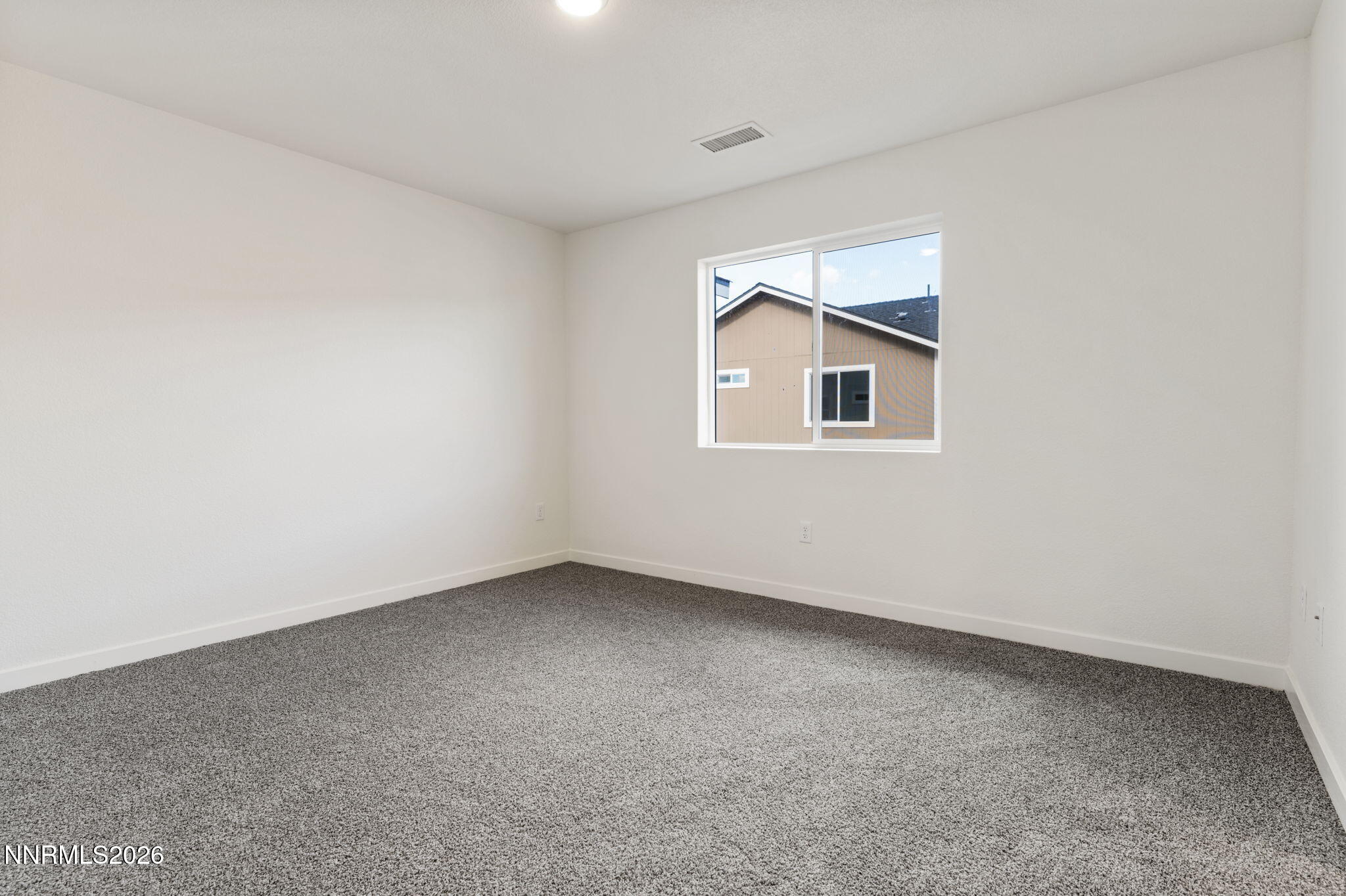 357 Halite Drive Dayton, NV 89403 - Photo 7 of 20 an empty room with a window