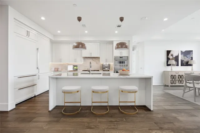 a kitchen with a sink cabinets and window