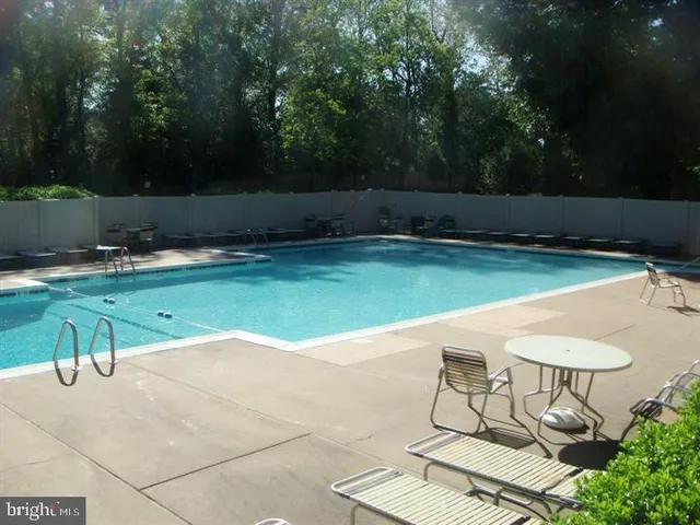 a view of swimming pool with a yard