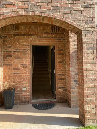 a view of a brick house with a door