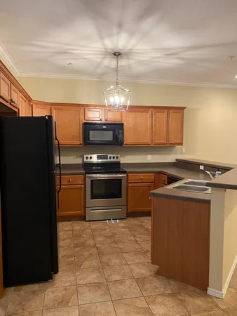 a kitchen with stainless steel appliances a stove and a refrigerator