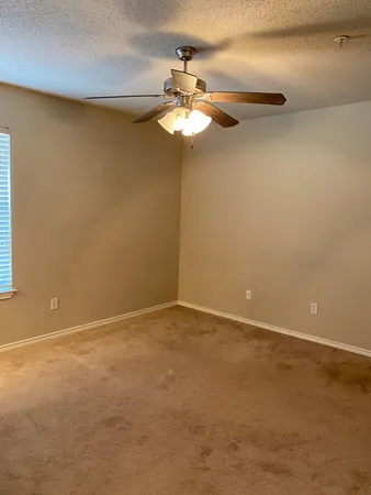 a view of a chandelier fan in a room