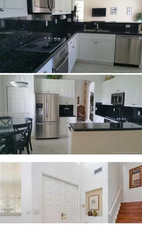 a view of living room kitchen with stainless steel appliances granite countertop cabinets and stove