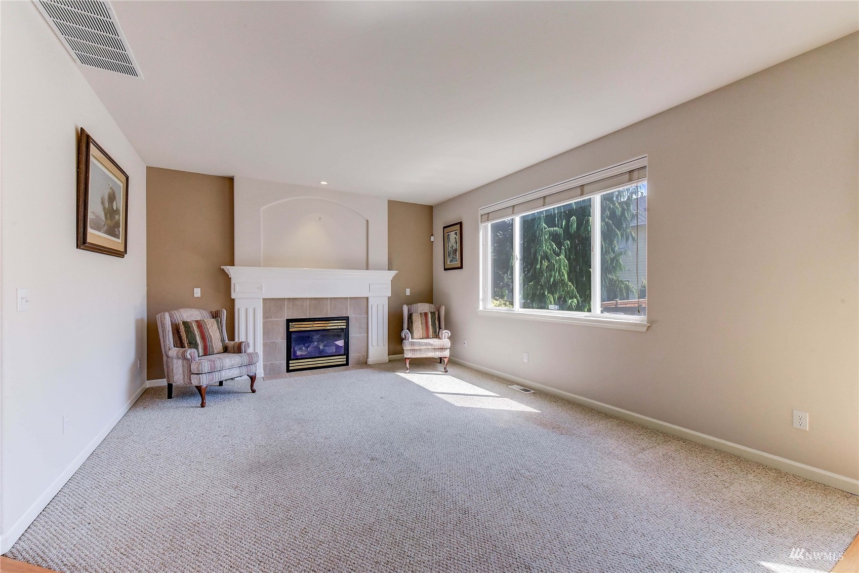 19723 Bartlett Road Bothell, WA 98012 - Photo 9 of 21 a living room with furniture window and a fireplace