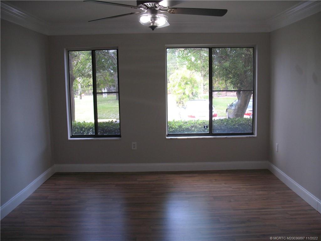 5393 Southeast Miles Grant Road, Unit A103 Stuart, FL 34997 - Photo 12 of 20 Master Bedroom