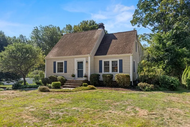 a view of a house with a yard and plants