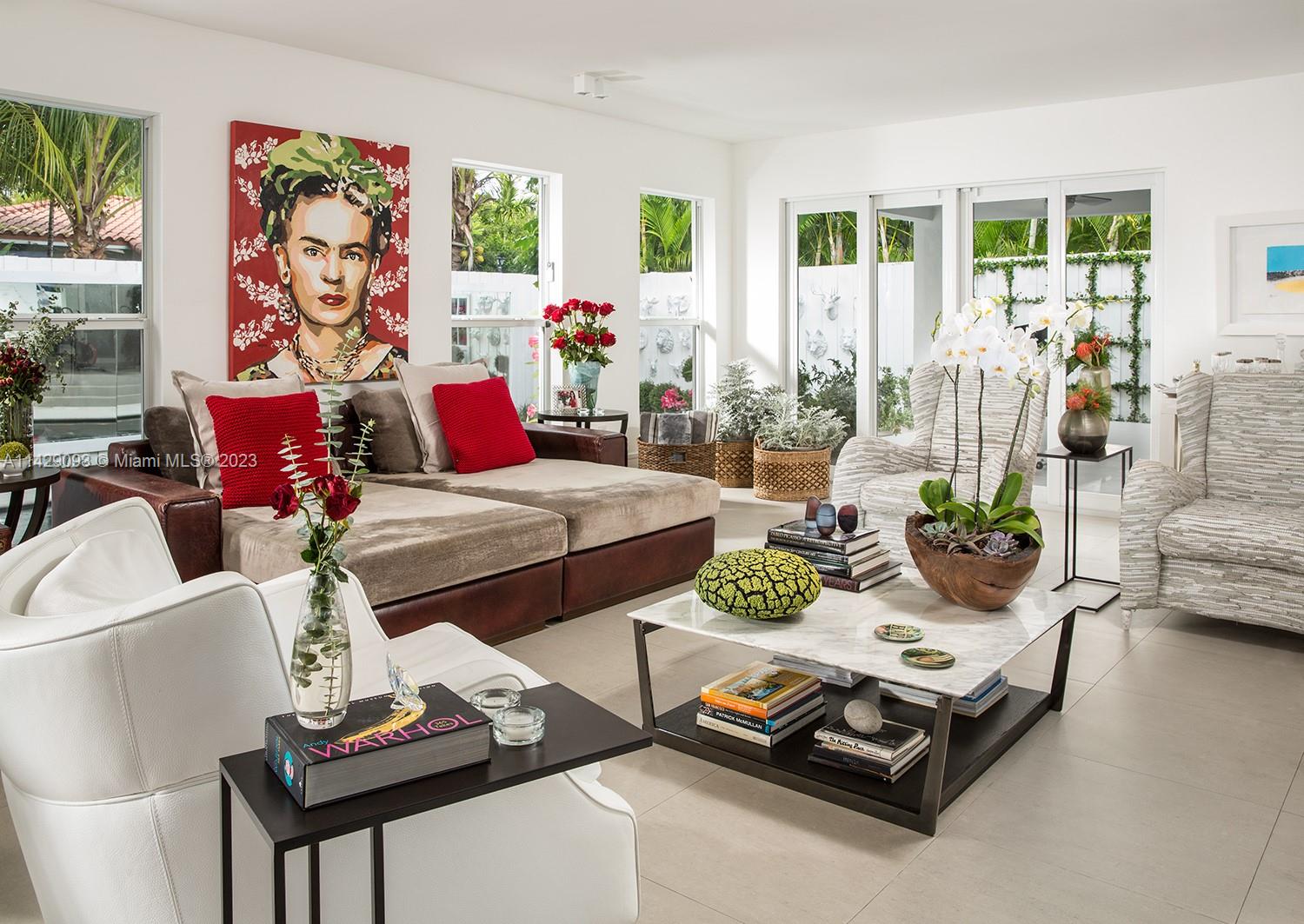 Morningside Miami, FL 33137 - Photo 18 of 29 a living room with furniture and a floor to ceiling window
