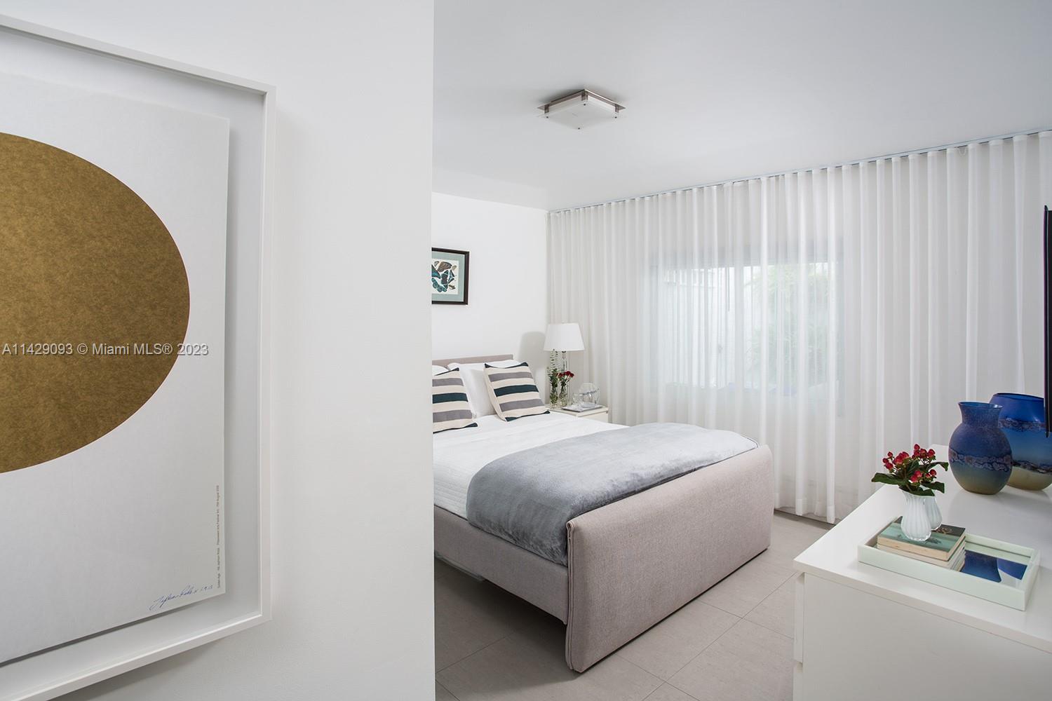 Morningside Miami, FL 33137 - Photo 2 of 29 a room with a bed and a chair