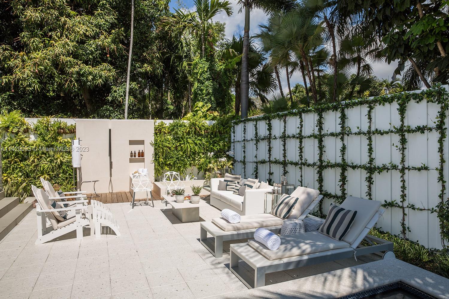 Morningside Miami, FL 33137 - Photo 23 of 29 a view of a patio with couches table and chairs and potted plants