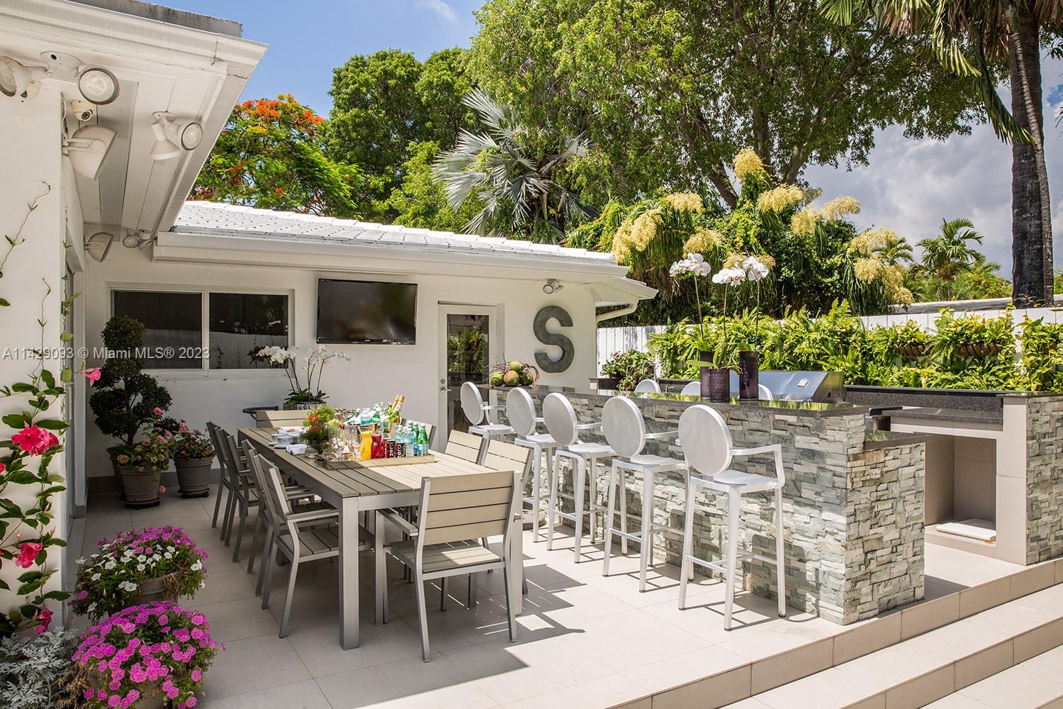 Morningside Miami, FL 33137 - Photo 27 of 29 a view of a patio with table and chairs and potted plants
