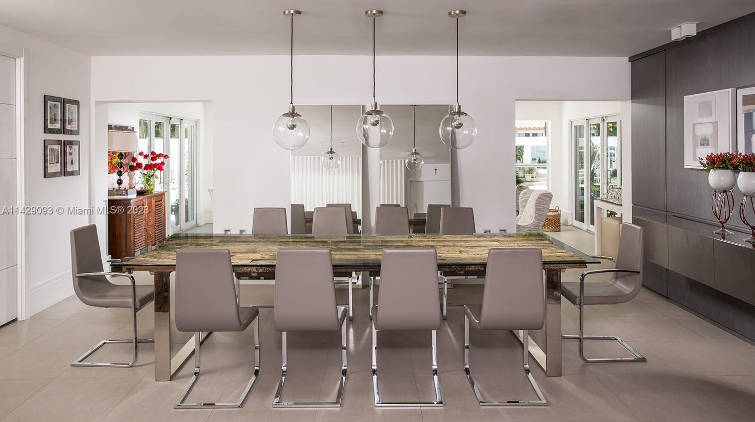 Morningside Miami, FL 33137 - Photo 10 of 29 a dining table with chairs and window