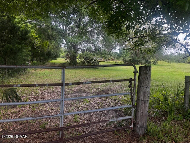 0 Tymber Creek Road Ormond Beach, FL 32174 - Photo 4 of 8 a view of a yard with wooden fence