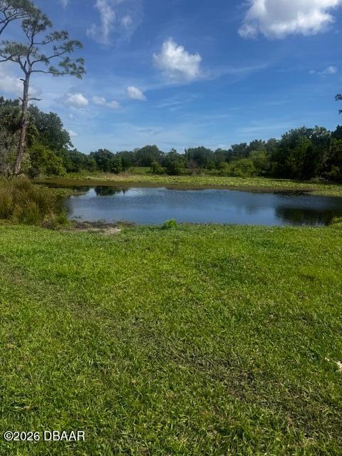 0 Tymber Creek Road Ormond Beach, FL 32174 - Photo 5 of 8 a view of a lake with houses in the back