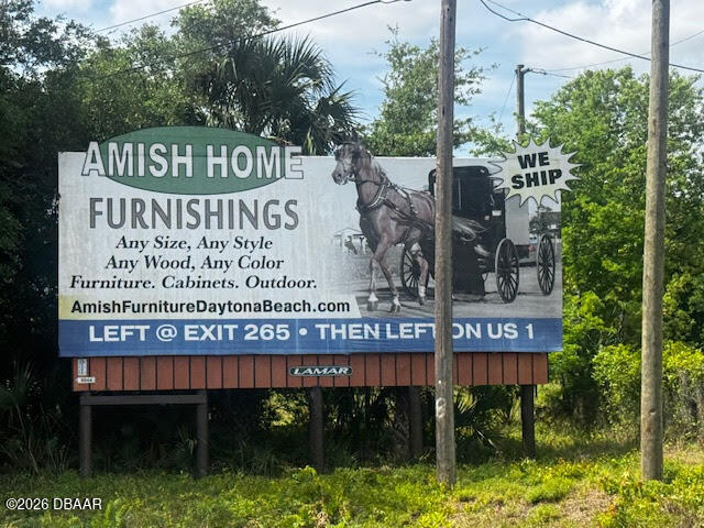 0 Tymber Creek Road Ormond Beach, FL 32174 - Photo 6 of 8 a view of a sign board with a pool
