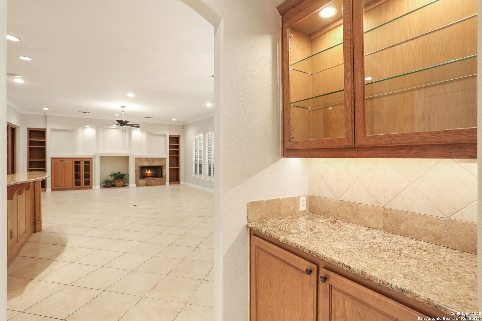 24630 Bogey Ridge San Antonio, TX 78260 - Photo 18 of 50 a view of a kitchen with kitchen island a sink wooden floor and counter space