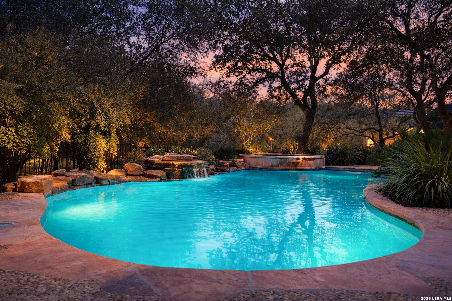 24630 Bogey Ridge San Antonio, TX 78260 - Photo 2 of 50 a view of a swimming pool with lawn chairs under an umbrella