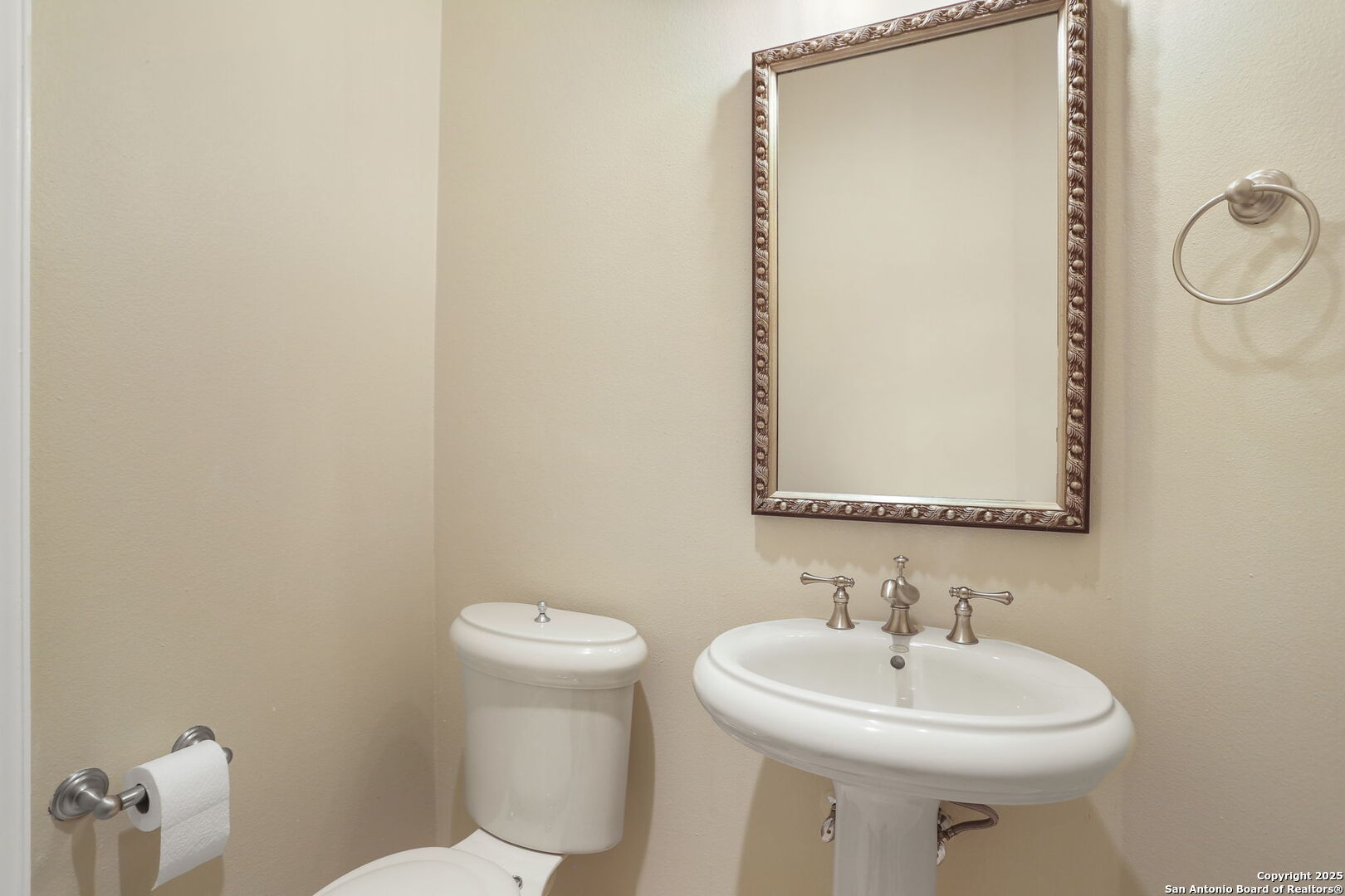 24630 Bogey Ridge San Antonio, TX 78260 - Photo 30 of 50 a bathroom with a sink a toilet and mirror