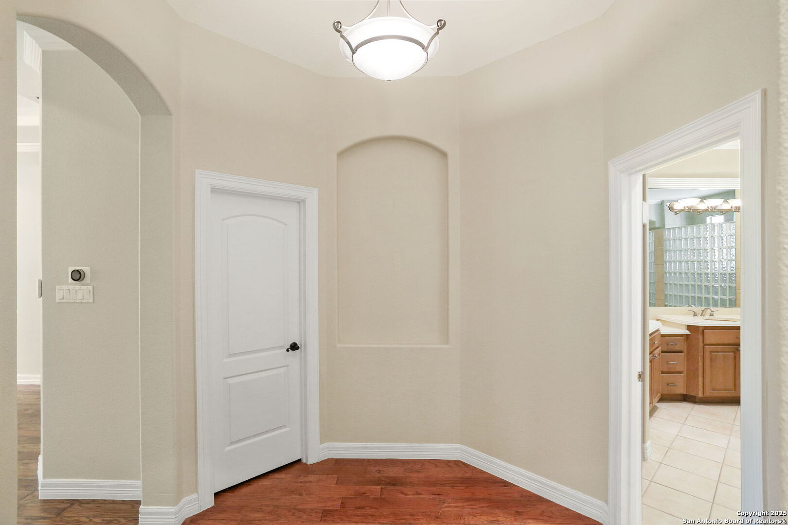 24630 Bogey Ridge San Antonio, TX 78260 - Photo 31 of 50 a view of a room that has a bed and a chandelier fan