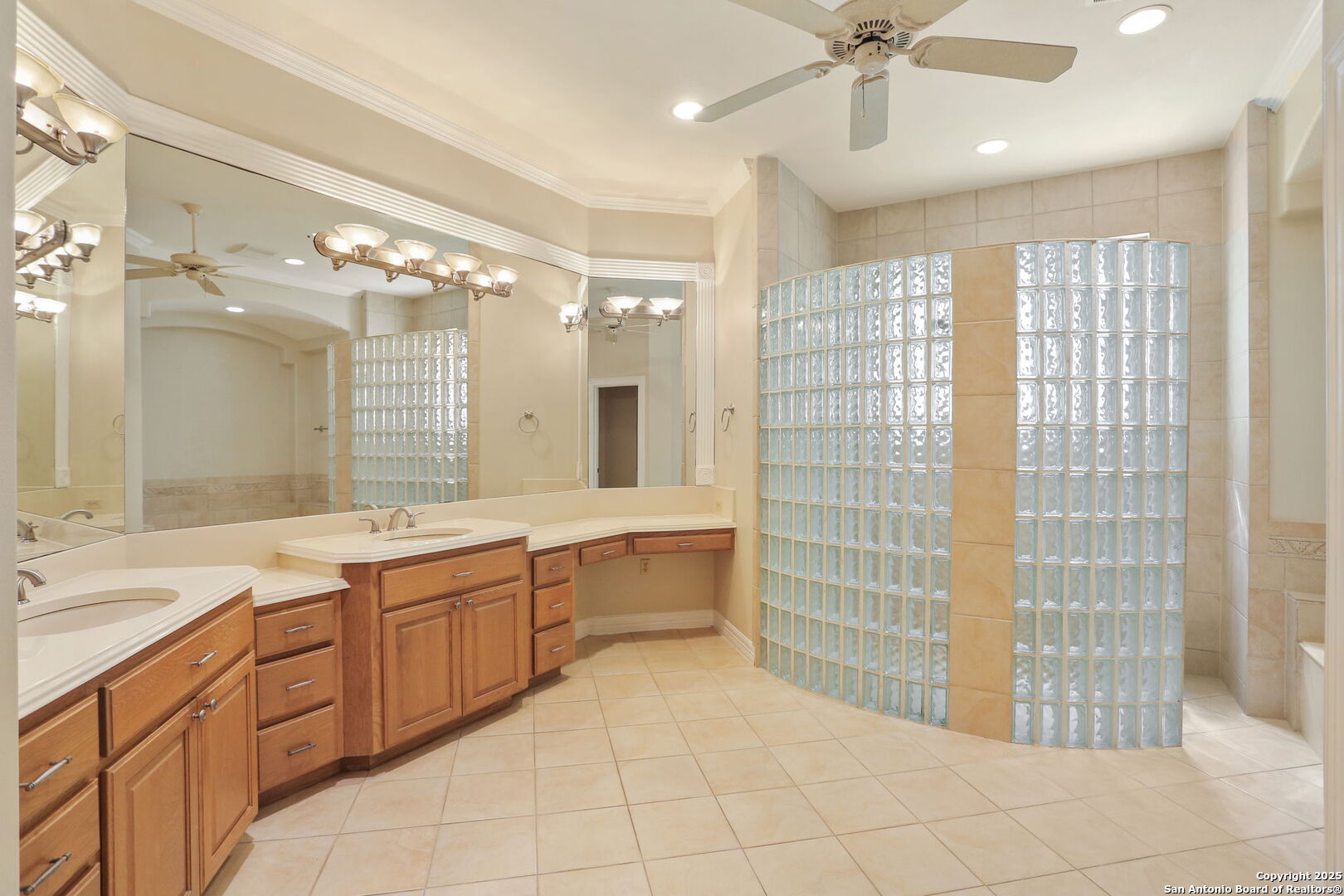 24630 Bogey Ridge San Antonio, TX 78260 - Photo 34 of 50 a large bathroom with a sink a large mirror and a shower