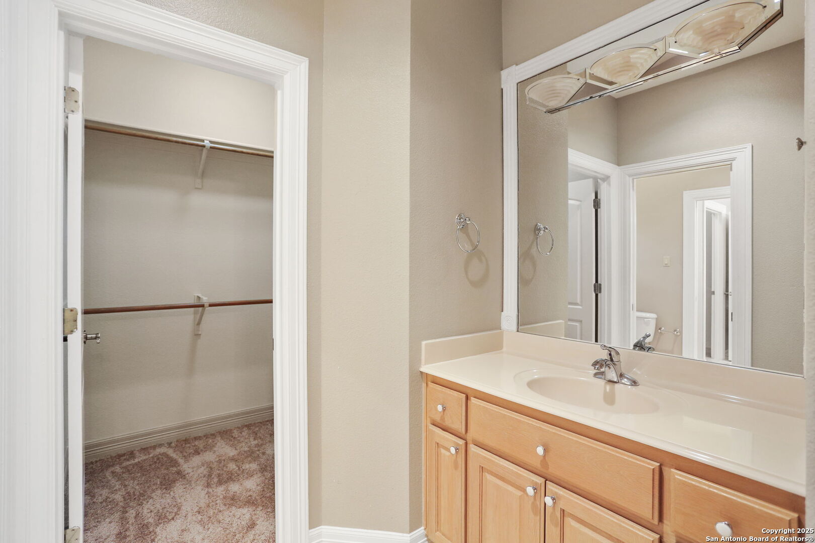 24630 Bogey Ridge San Antonio, TX 78260 - Photo 42 of 50 a bathroom with a shower sink and mirror