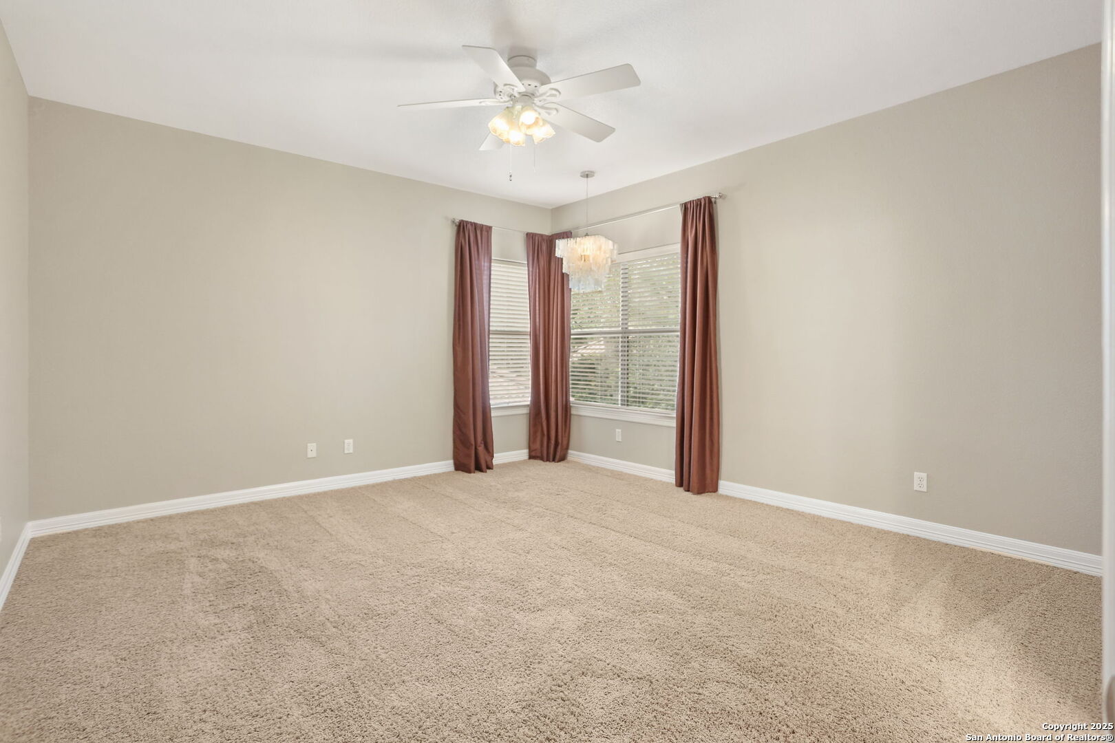 24630 Bogey Ridge San Antonio, TX 78260 - Photo 44 of 50 an empty room with windows and fan