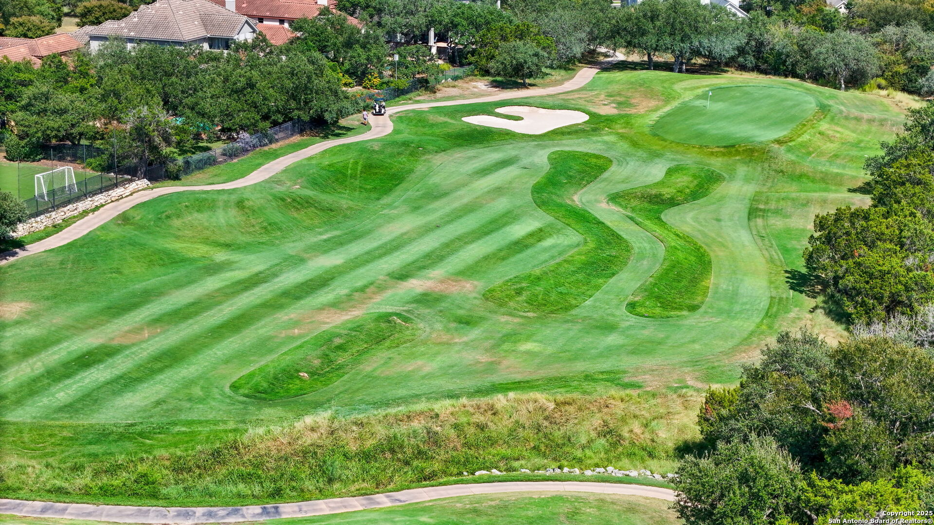 24630 Bogey Ridge San Antonio, TX 78260 - Photo 48 of 50 a view of a swimming pool with a yard