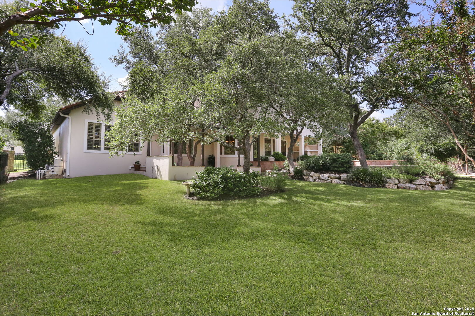 24630 Bogey Ridge San Antonio, TX 78260 - Photo 7 of 50 a front view of a house with garden