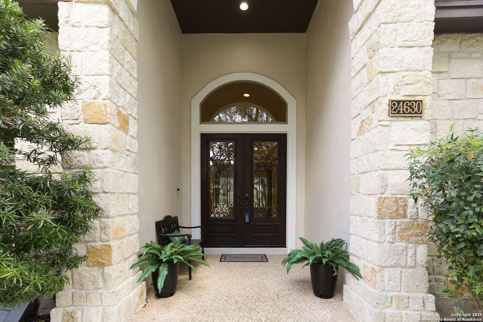 24630 Bogey Ridge San Antonio, TX 78260 - Photo 8 of 50 a front view of a house with a garden