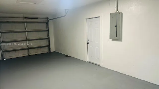 a view of an empty room and a window