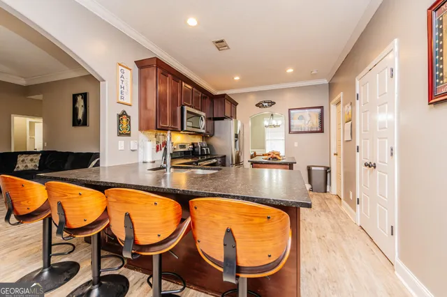 a living room with furniture flat screen tv and a fireplace