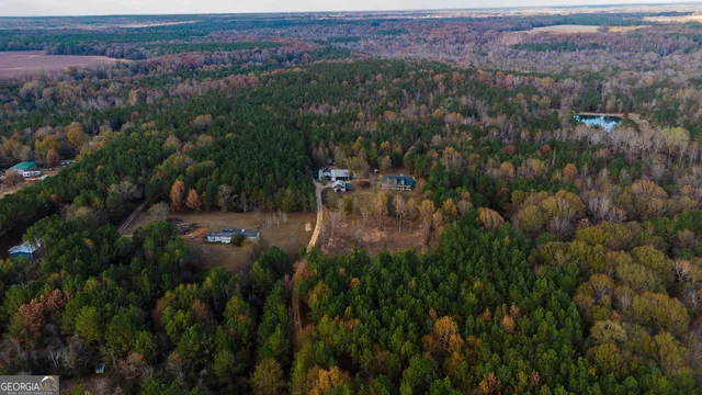 a view of a bedroom with baby and lounge chair