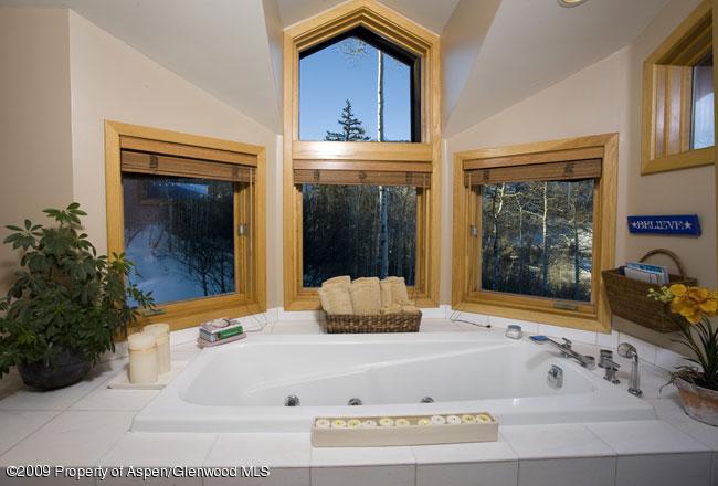 135 North Ridge Lane Snowmass Village, CO 81615 - Photo 3 of 8 a bathroom with a bathtub and shower