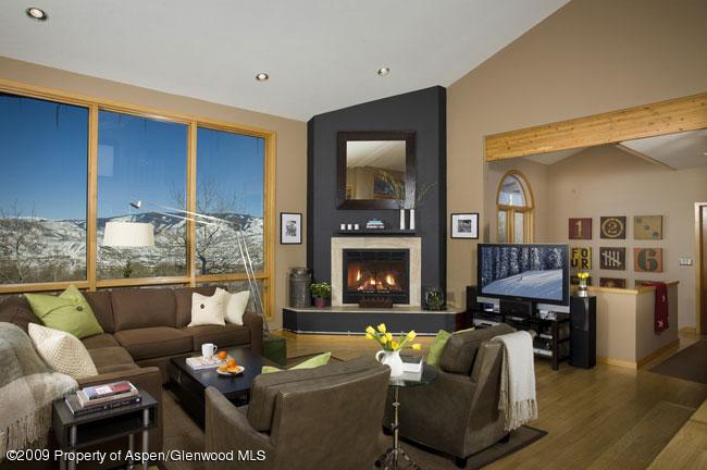 135 North Ridge Lane Snowmass Village, CO 81615 - Photo 6 of 8 a living room with furniture and a fireplace