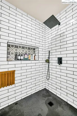 a view of a door and brick wall