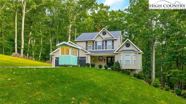a front view of a house with yard