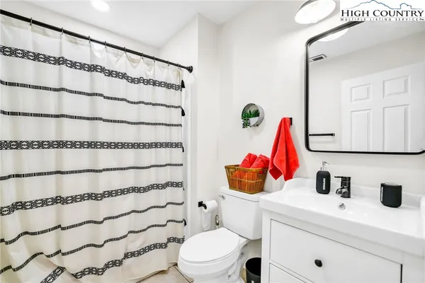 a bathroom with a toilet and a sink
