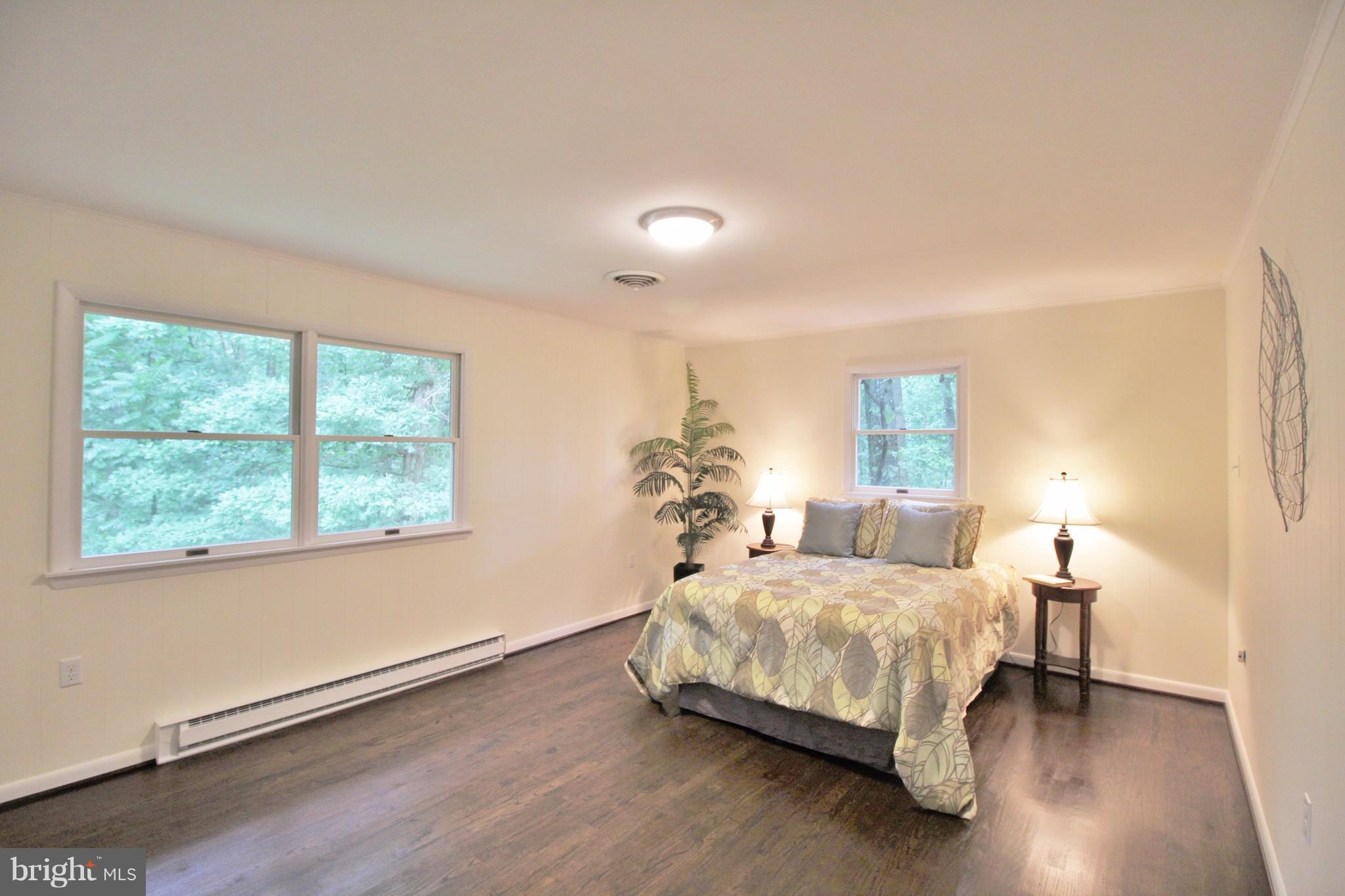 12919 Old Annapolis Road Mount Airy, MD 21771 - Photo 15 of 30 a bedroom with a bed and window