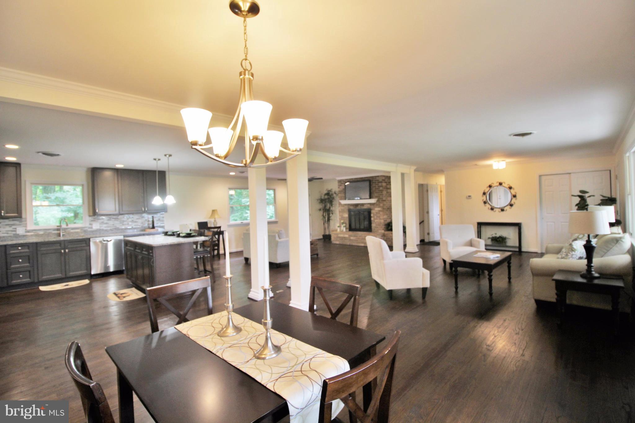 12919 Old Annapolis Road Mount Airy, MD 21771 - Photo 2 of 30 a living room with fireplace furniture and a wooden floor