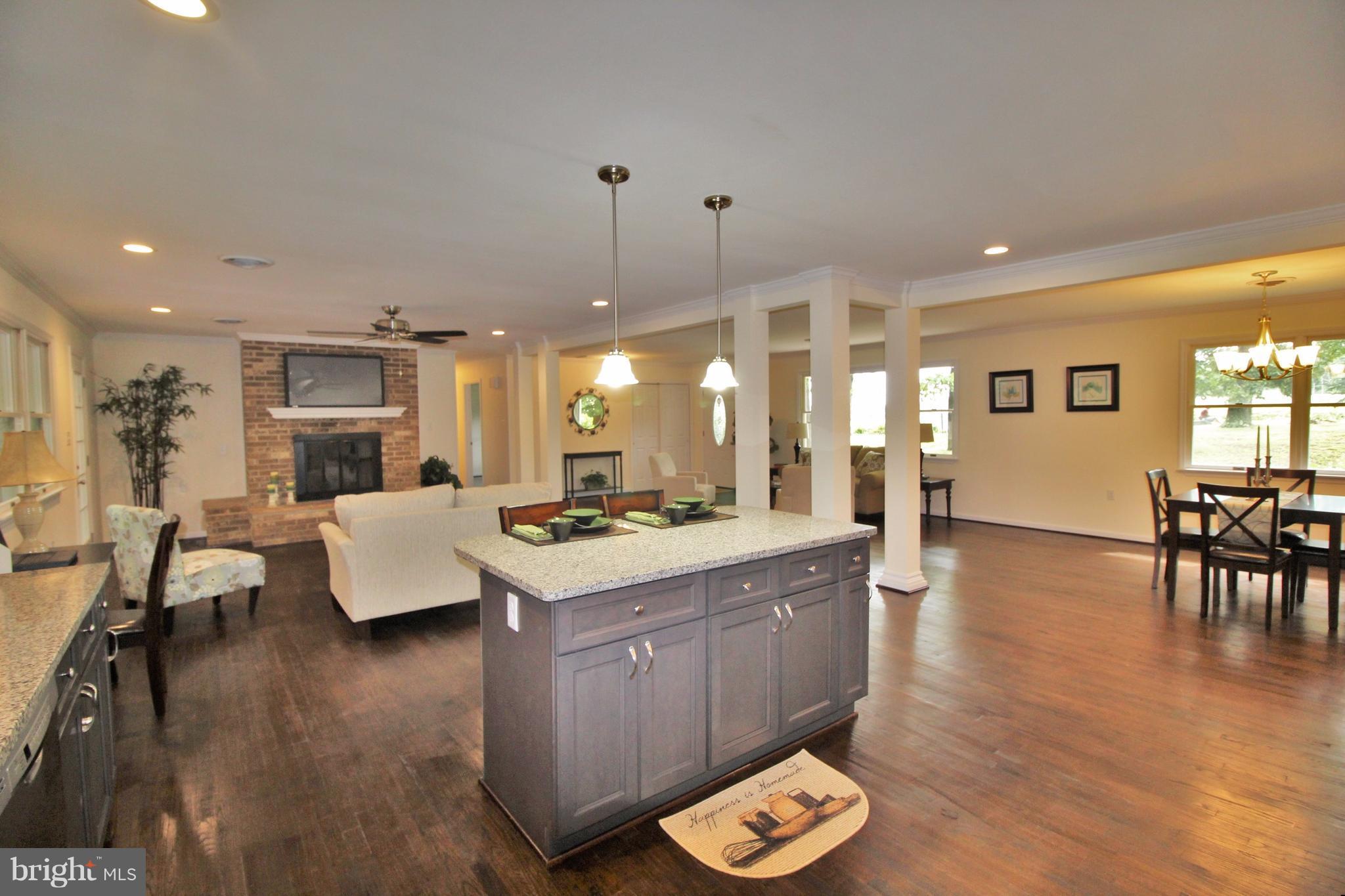 12919 Old Annapolis Road Mount Airy, MD 21771 - Photo 3 of 30 a large kitchen with a table and chairs