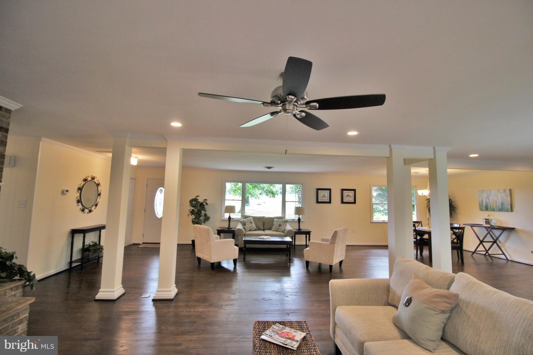 12919 Old Annapolis Road Mount Airy, MD 21771 - Photo 5 of 30 a living room with furniture and wooden floor