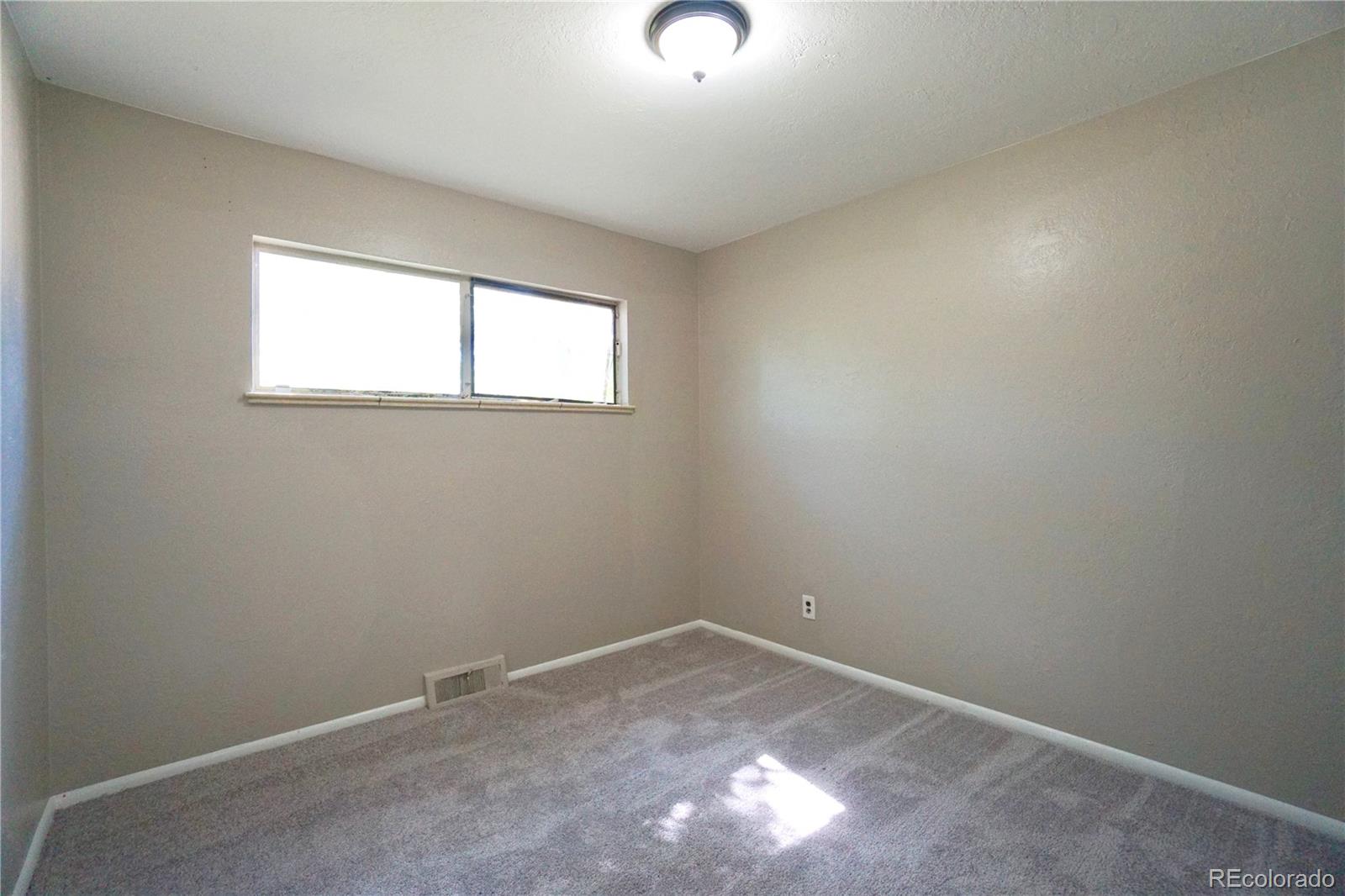 2519 15th Avenue Greeley, CO 80631 - Photo 16 of 25 an empty room with a window
