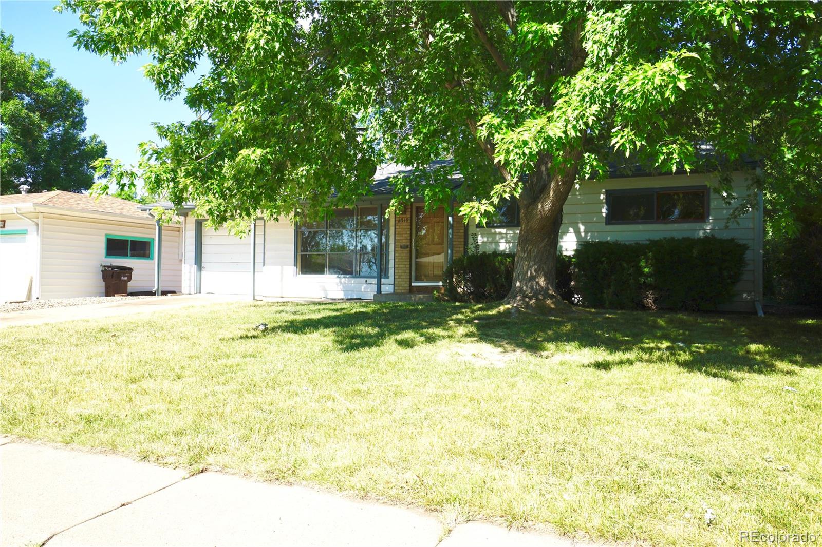2519 15th Avenue Greeley, CO 80631 - Photo 3 of 25 a swimming pool with outdoor seating and yard