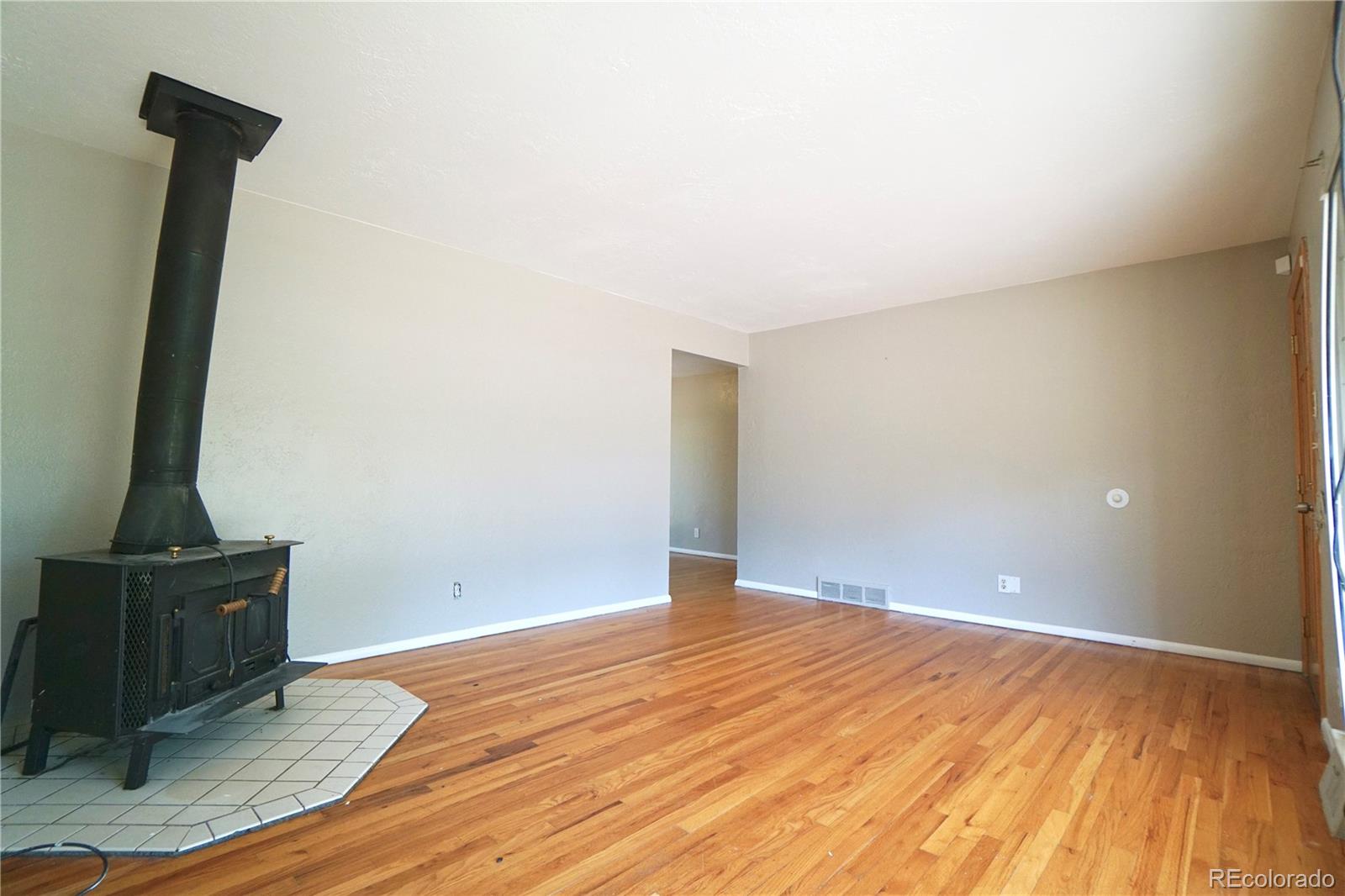 2519 15th Avenue Greeley, CO 80631 - Photo 5 of 25 a view of empty room with wooden floor