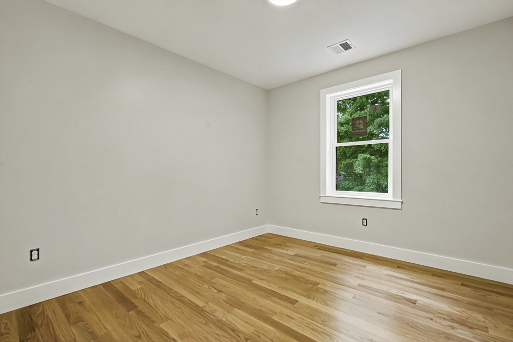4 Mayhew Street Framingham, MA 01702 - Photo 27 of 42 an empty room with a window