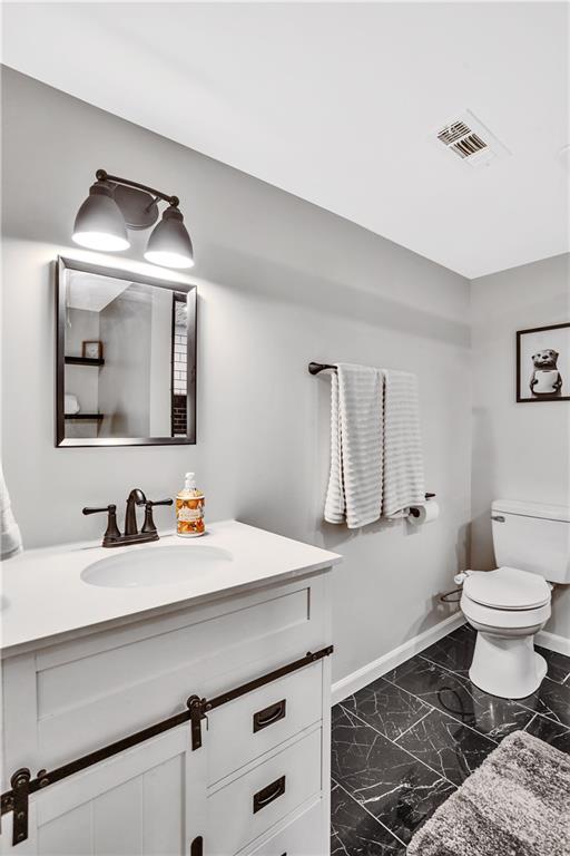 2012 Forge Drive Aliquippa, PA 15001 - Photo 27 of 34 a bathroom with a toilet sink and mirror