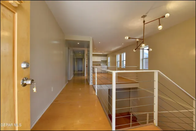 a view of a living room with a kitchen