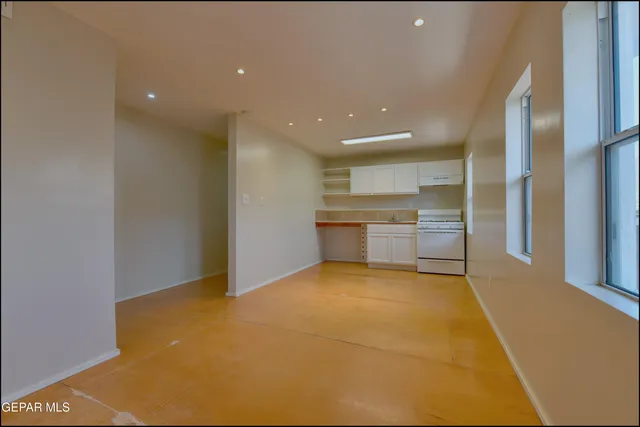 a kitchen with a sink cabinets and a window