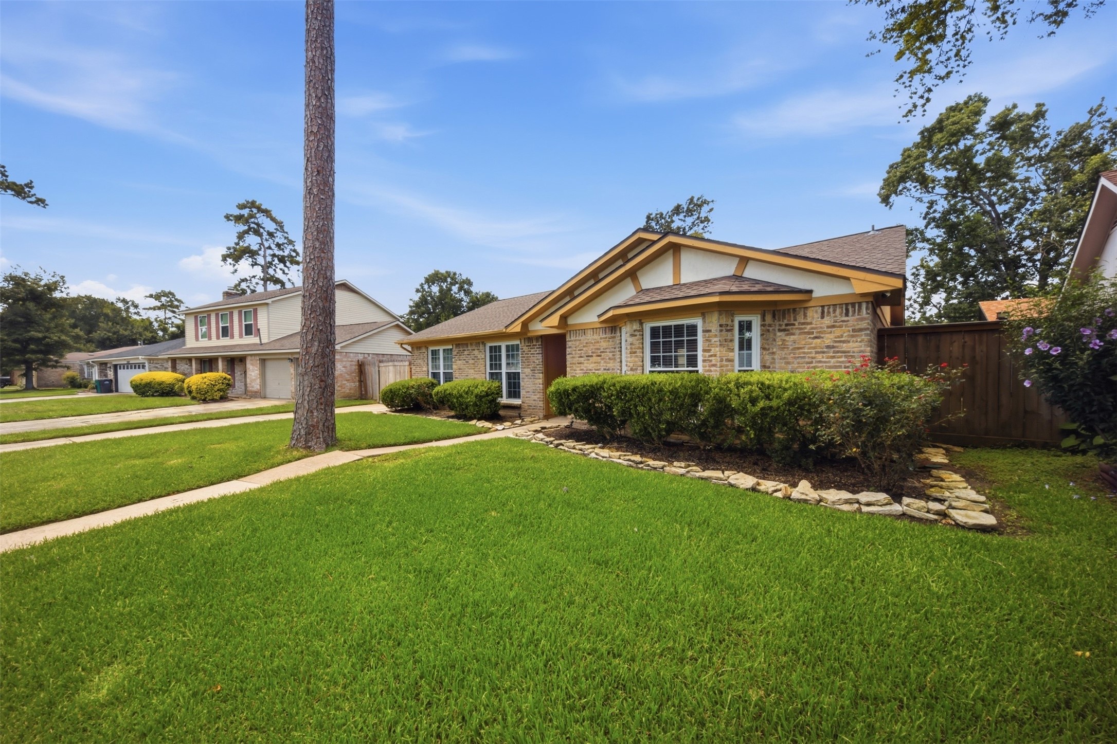 24015 Spring Mill Lane Spring, TX 77373 - Photo 7 of 49 Beautiful landscaping and generous green space create a picturesque approach.